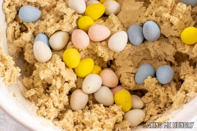 mini eggs on top of cookie dough