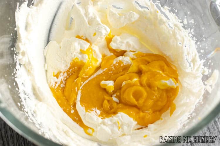 whipped cream and mango pudding in bowl