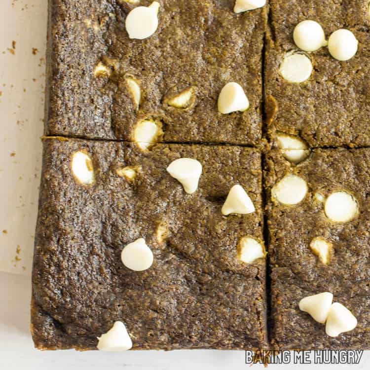 close up of white chocolate matcha blondies cut into squares