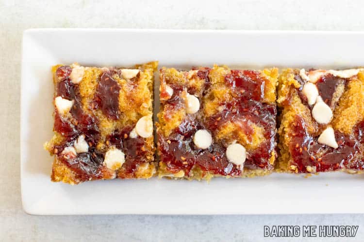 rectangular plate with four of the White Chocolate and Raspberry Blondies