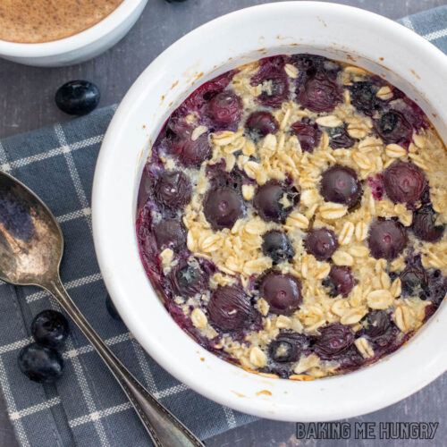baked oats for one in a bowl with blueberries