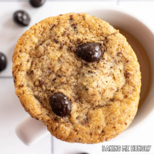 overhead shot of one of the coffee cookies sitting on top of a small mug of coffee