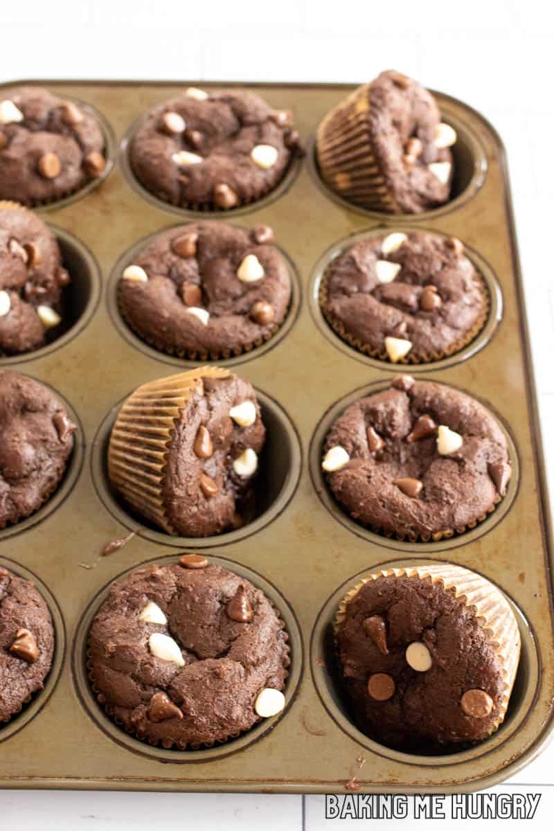 tin with triple chocolate muffins, some are sideways to show side view