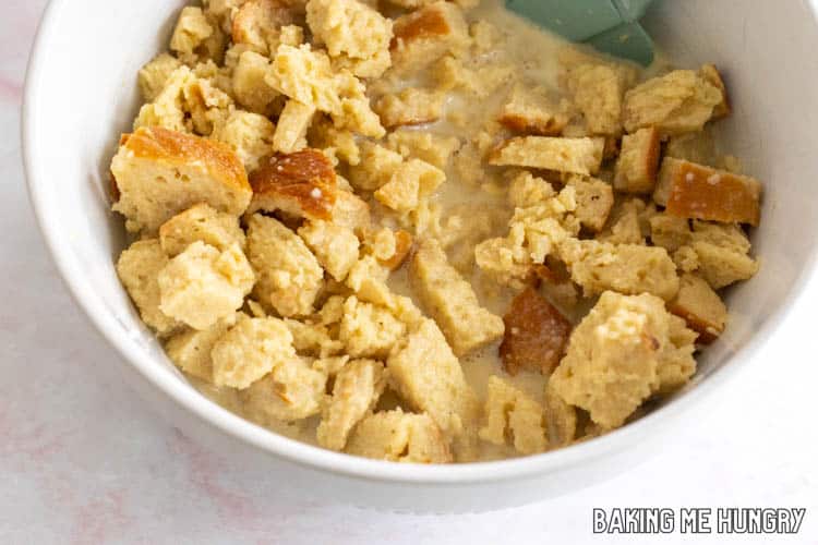 cubes of challah in bowl with liquid