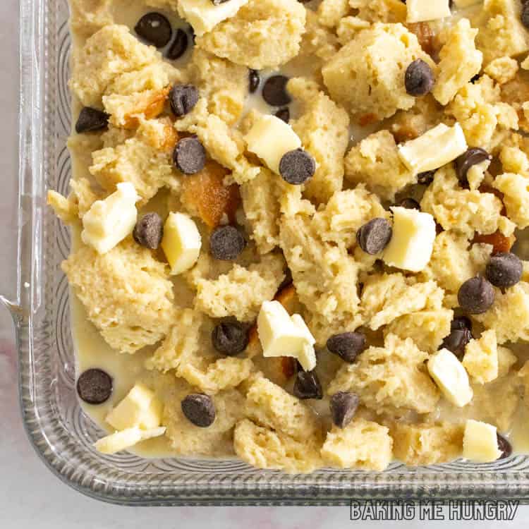 unbaked chocolate chip bread pudding in glass dish