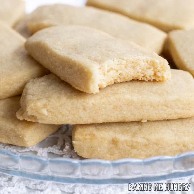 one of the 3 Ingredient Brown Sugar Cookies missing a bite on top of a stack of cookies