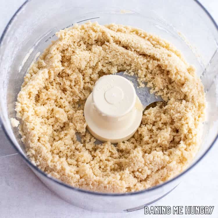 food processor with sandy looking dough