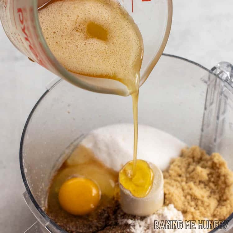 brown butter being poured into the food processor