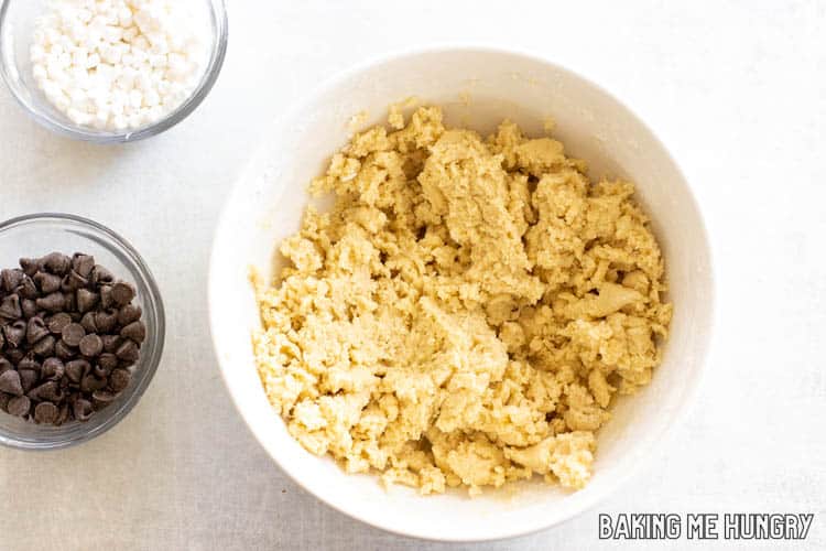 dough next to bowls of mix-ins