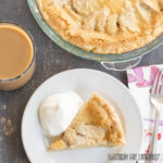 custard fruit pie with pears on plate and pie with pears behind