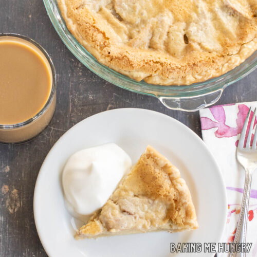 custard fruit pie with pears on plate and pie with pears behind