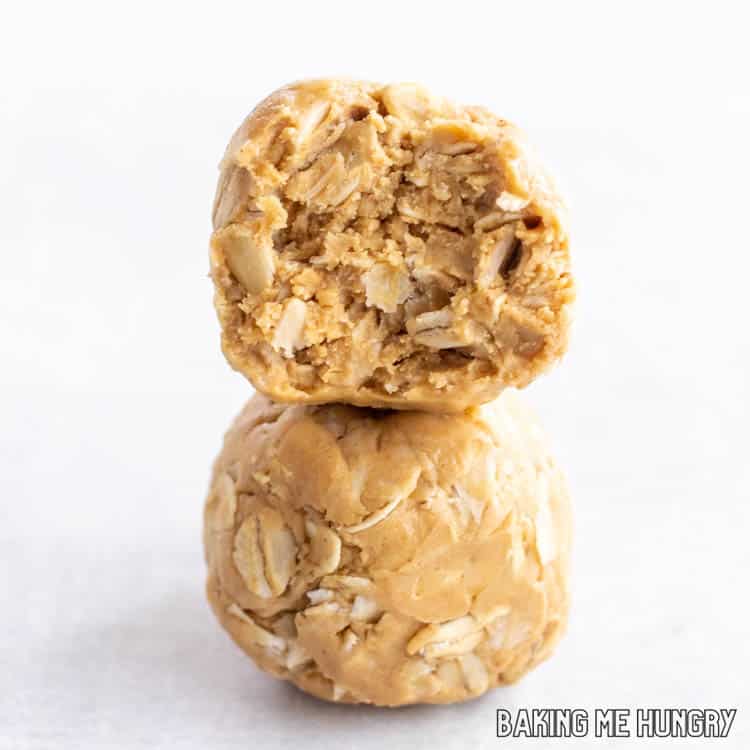 two of the 3 ingredient peanut butter oatmeal balls stacked on top of each other