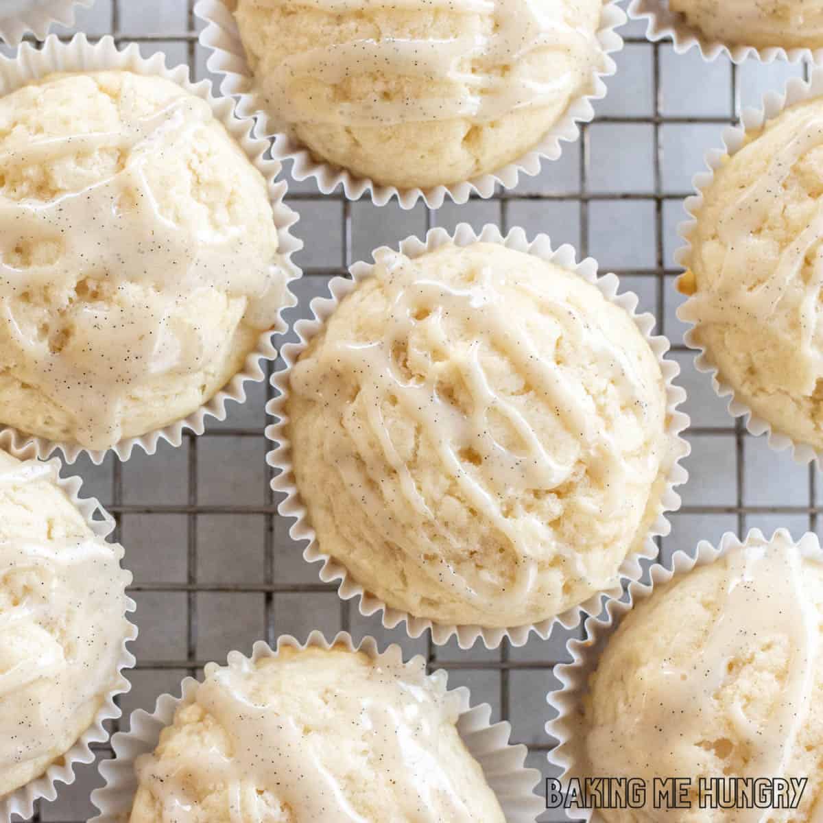 muffins with glaze from the vanilla muffins recipe on a cooling rack