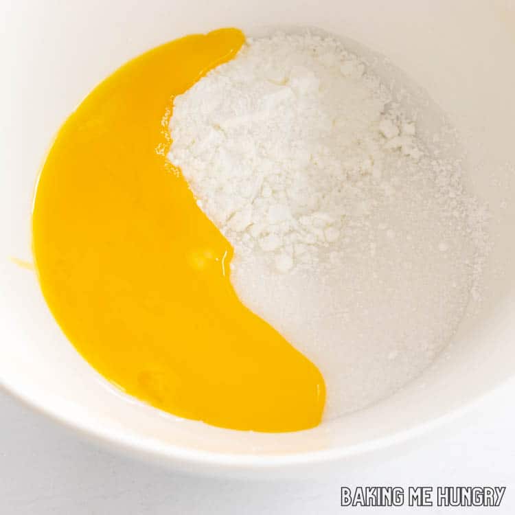 egg yolks added to bowl