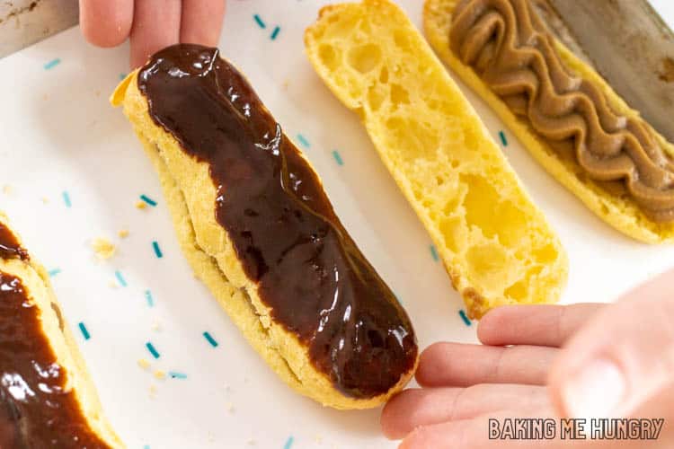 hands setting down chocolate topped pastry shell