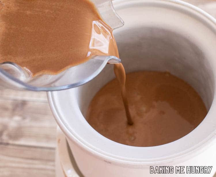 brown liquid being poured from blender into machine