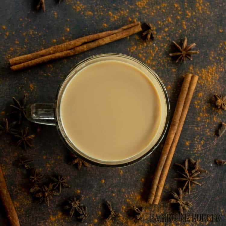 vanilla chai latte recipe in large mug surrounded by cinnamon and star anise