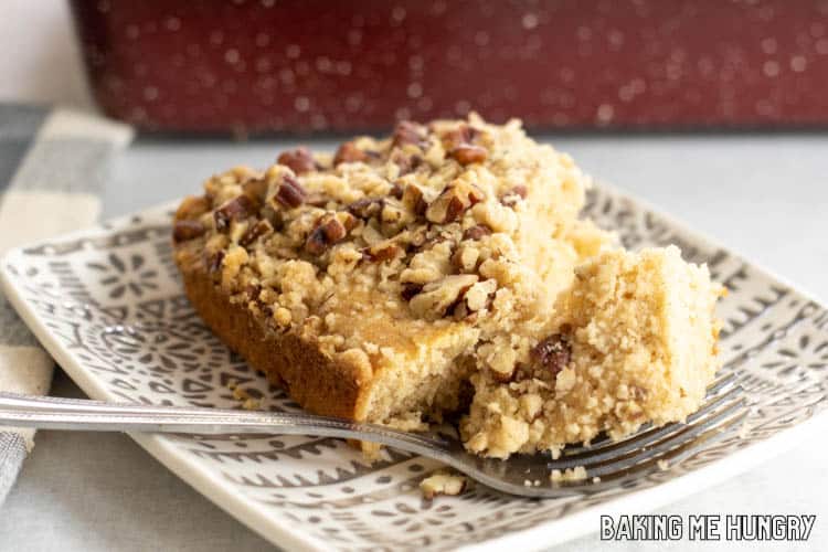 piece of cowboy coffee cake on plate with bite on fork