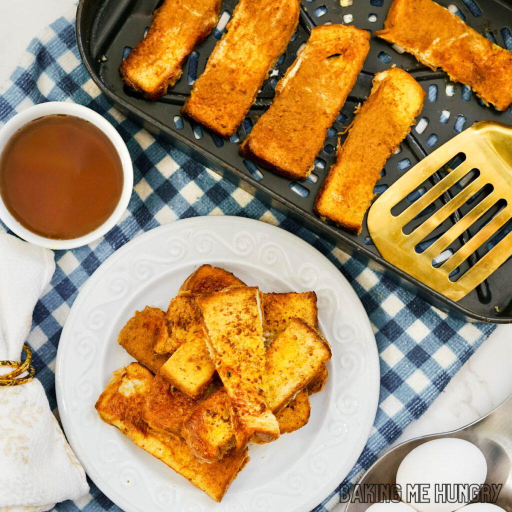 french toast sticks air fryer recipe served on a plate and shown in air fryer basket