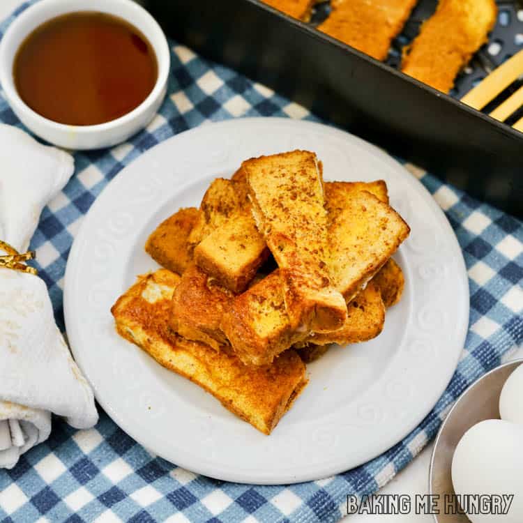 close up of air fryer french toast sticks on plate