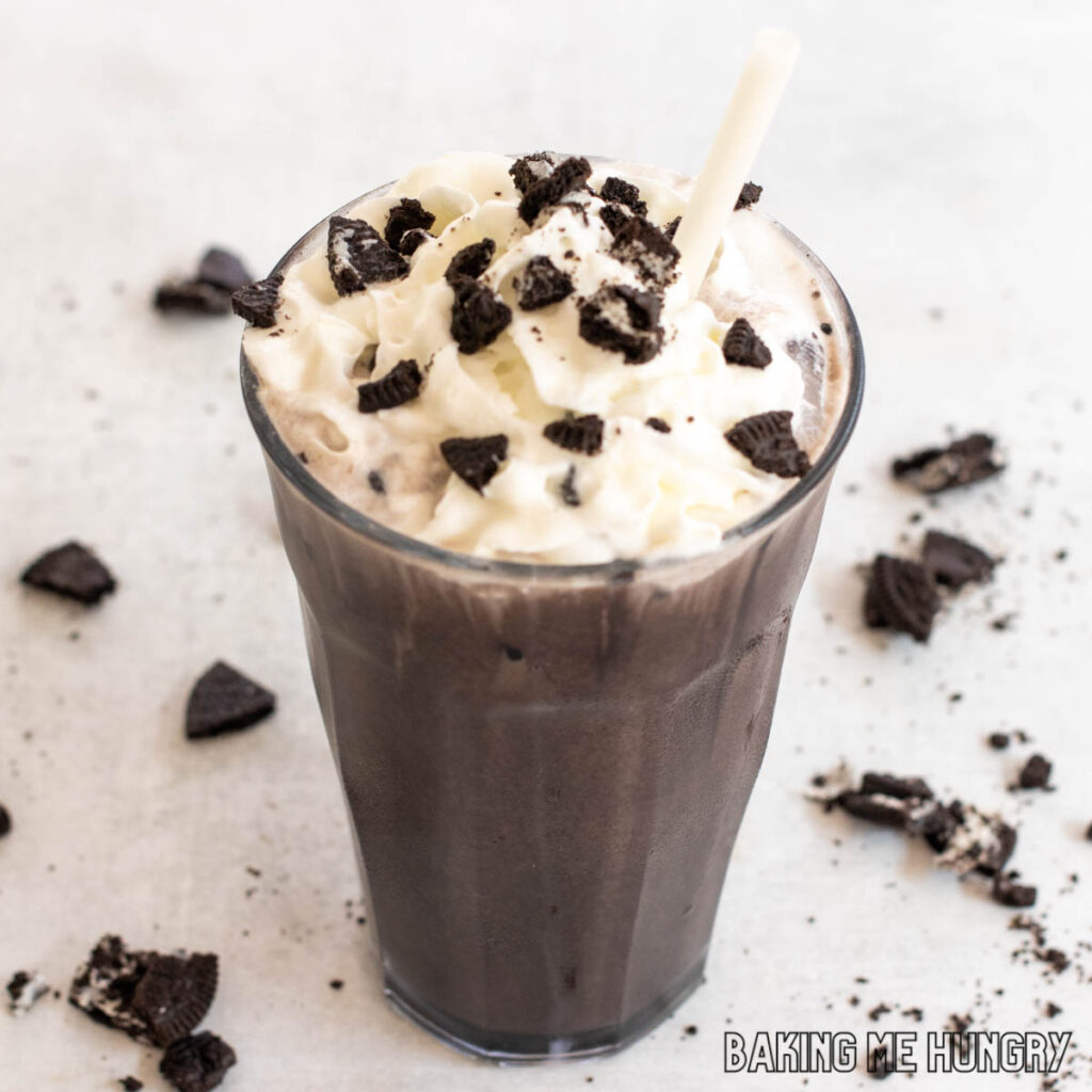 oreo iced coffee recipe garnished with whipped cream and crushed oreo cookies