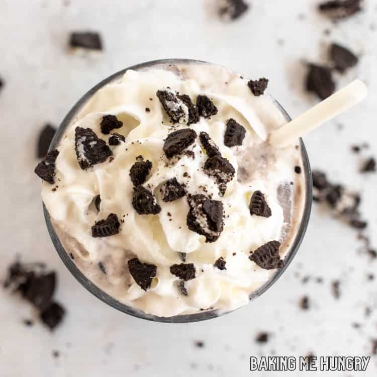 overhead shot of oreo iced coffee recipe garnished with whipped cream and crushed oreo cookies