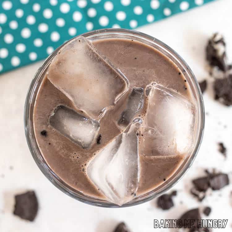 overhead shot of oreo iced coffee recipe in tall glass of ice