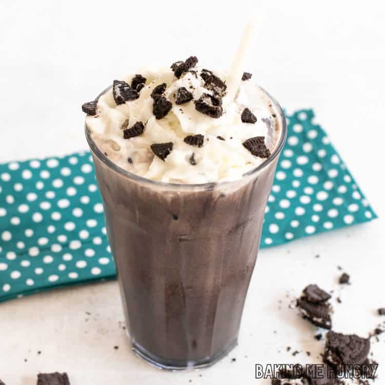 oreo iced coffee recipe in tall glass with straw and garnish