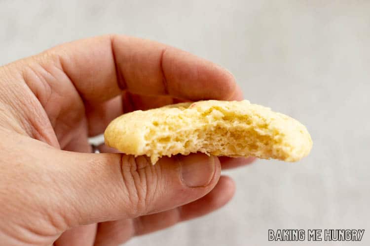 hand holding one of the 3 ingredient banana cookies missing a bite