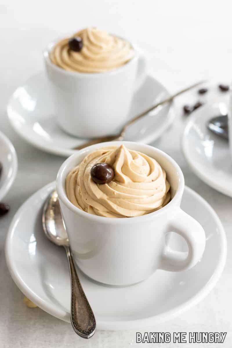 cup full of coffee mousse and garnished with a chocolate covered espresso bean