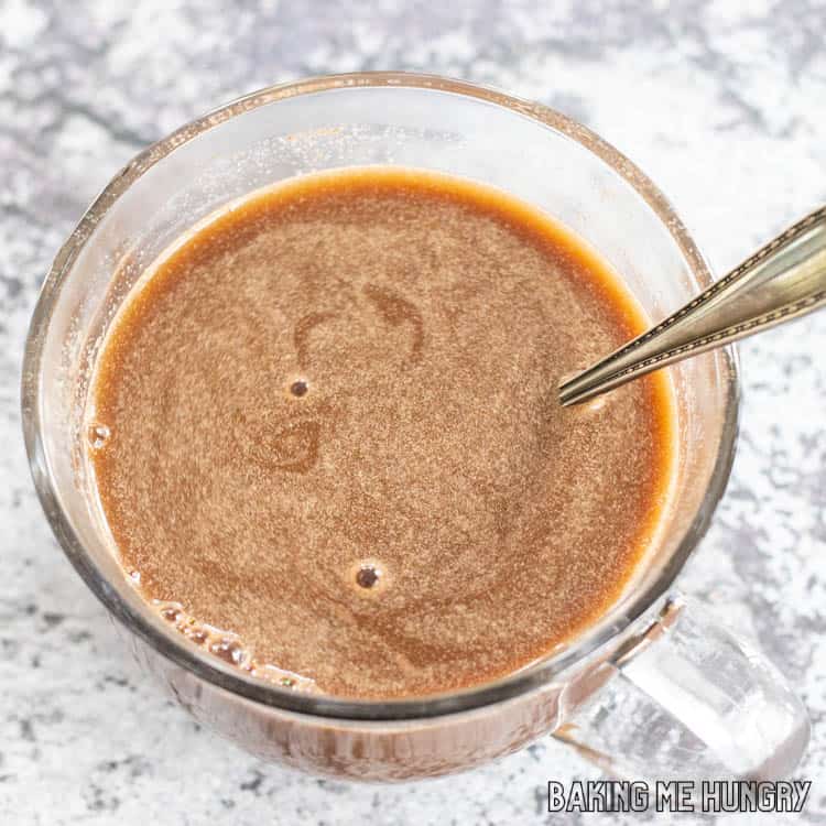 mug with spoon and hot chocolate coffee recipe