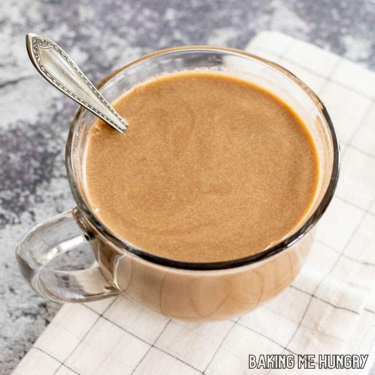 mug with hot chocolate coffee recipe and spoon