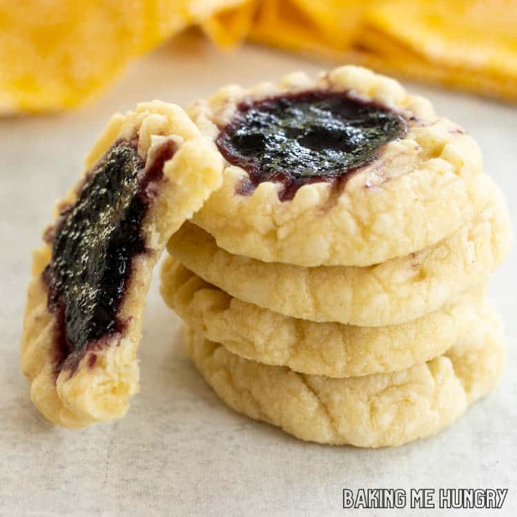 lemon blueberry cookies in a stack with one missing a bite