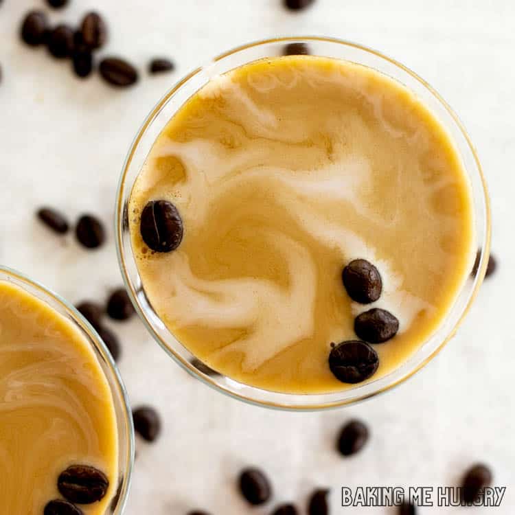 overhead shot of virgin espresso martini with cream and coffee beans