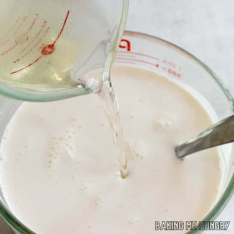 simple syrup being poured into cream