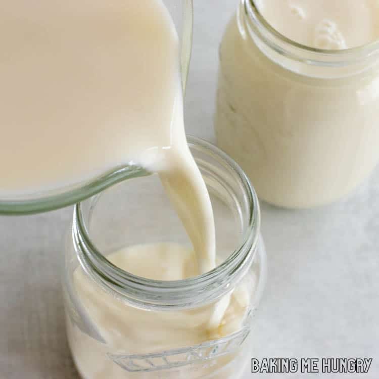 creamy mixture being poured into jars