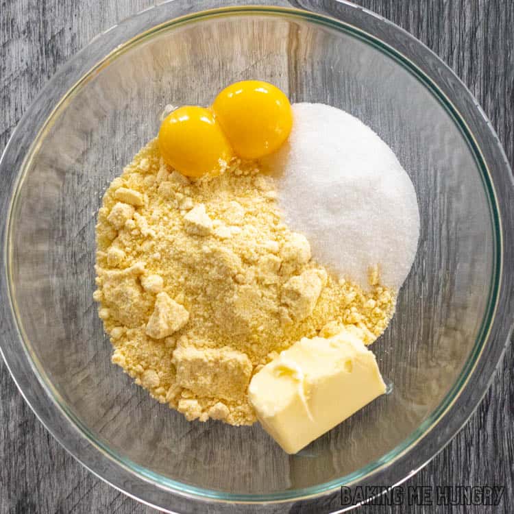 mixing bowl with egg yolks and dry ingredients