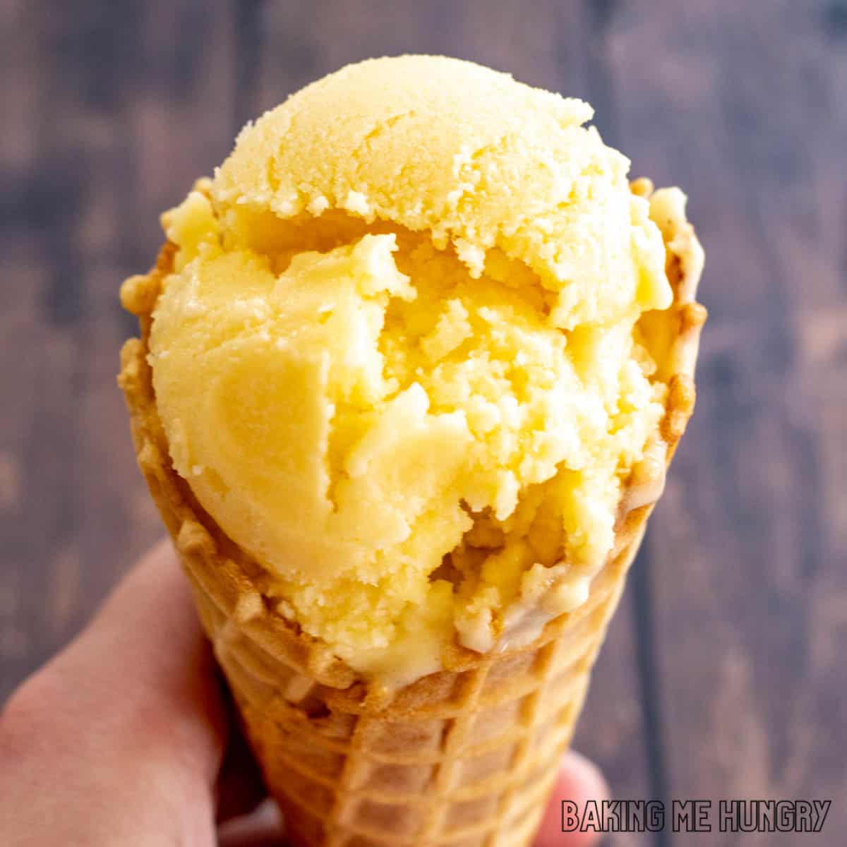 mango coconut ice cream on a waffle cone