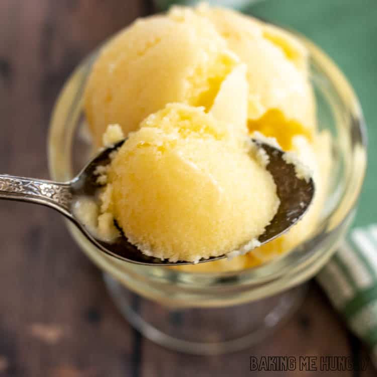 spoon with a bite of mango coconut ice cream