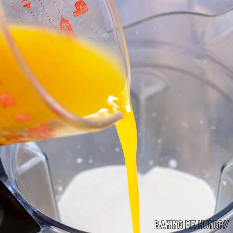 mango nectar being added to blender