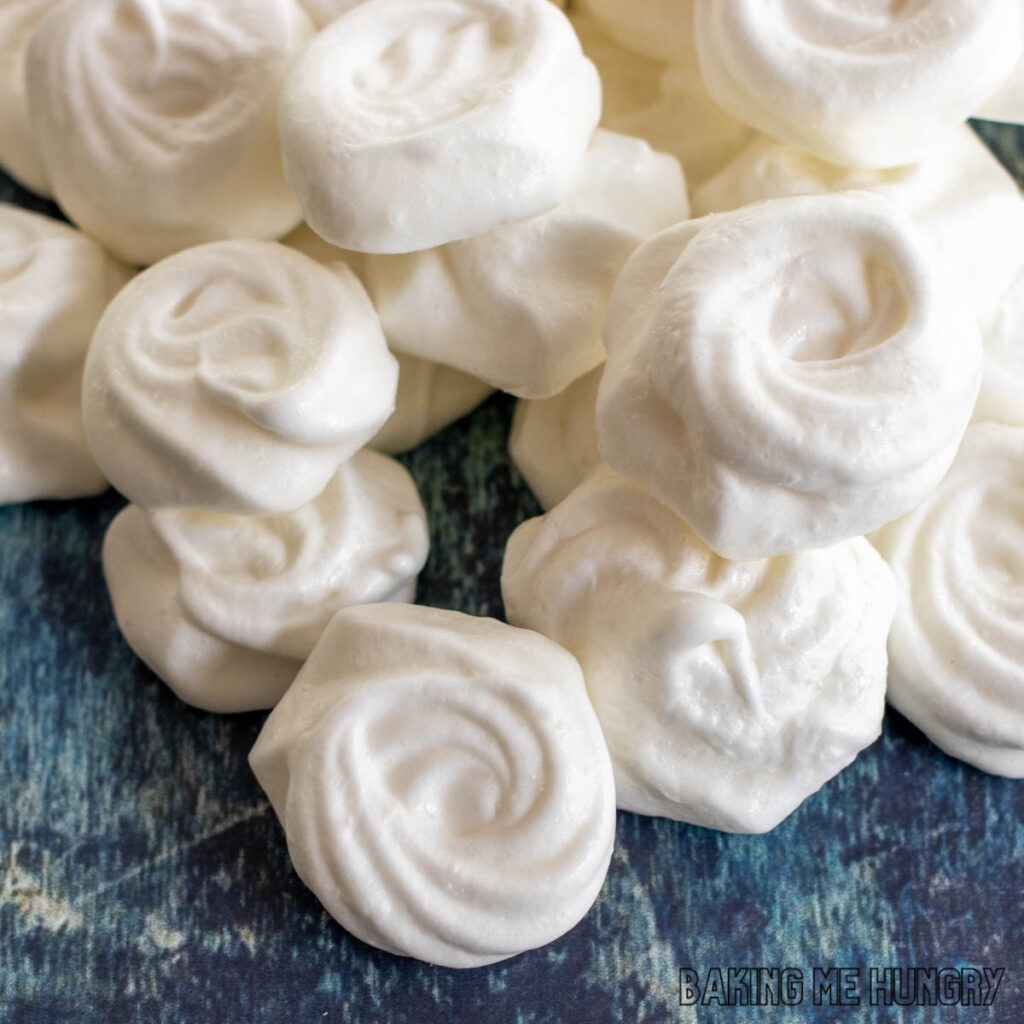 mini meringues recipe shown with small cookies in a pile