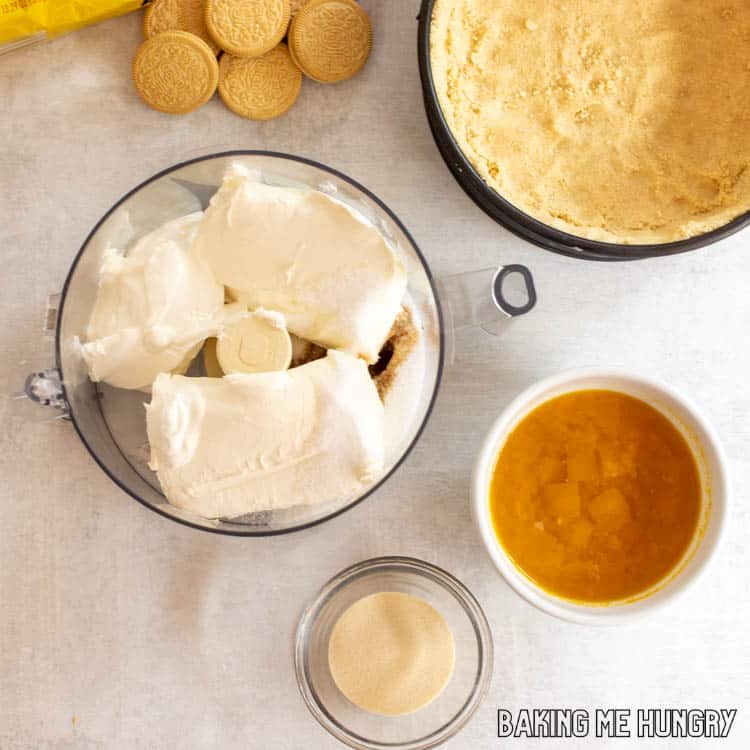 ingredients in small bowls next to crust in pan