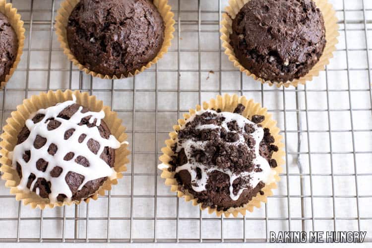 plain muffins, muffins with glaze, and muffins with glaze and crushed cookies on cooling rack