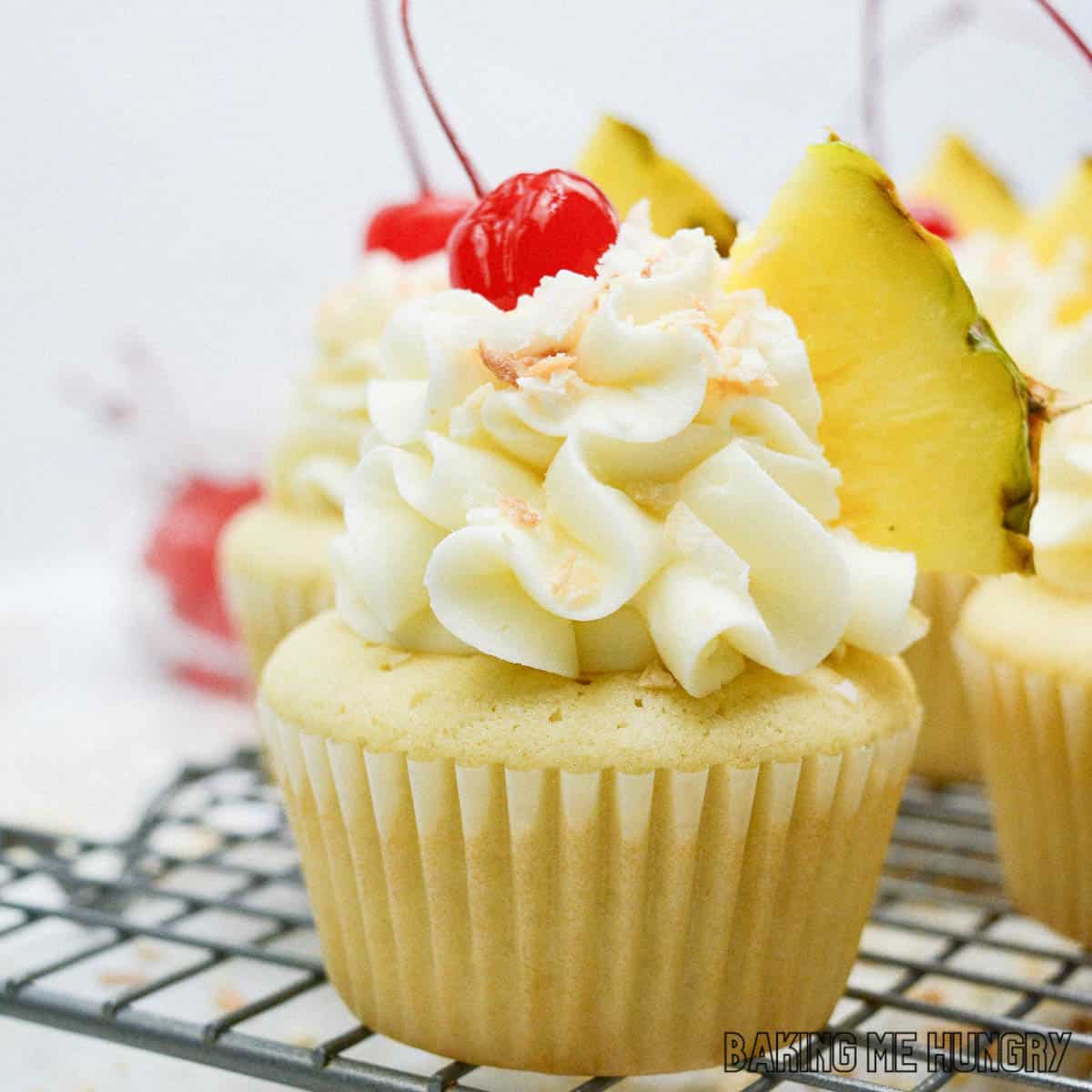 pineapple coconut cupcakes on wire rack