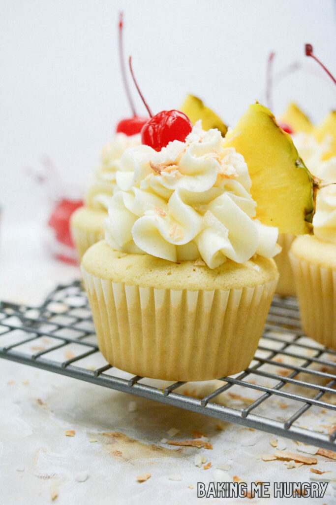 pineapple coconut cupcakes on wire rack