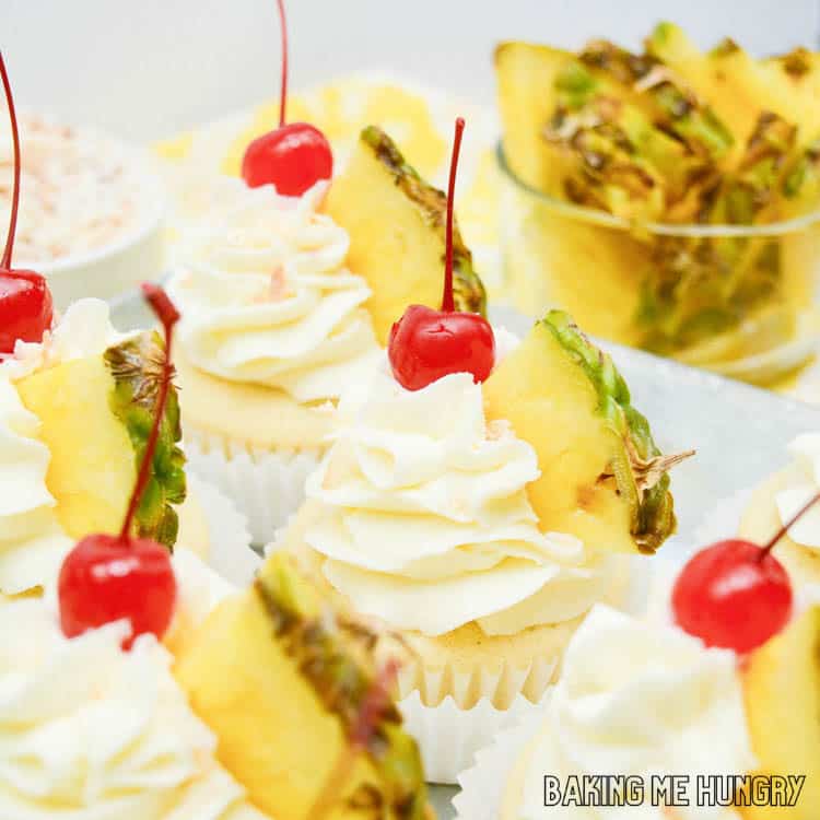 pineapple coconut cupcakes with pineapple cherry garnish close up