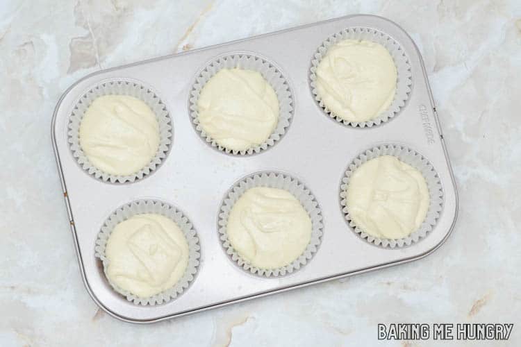 batter in cupcake liners in pan