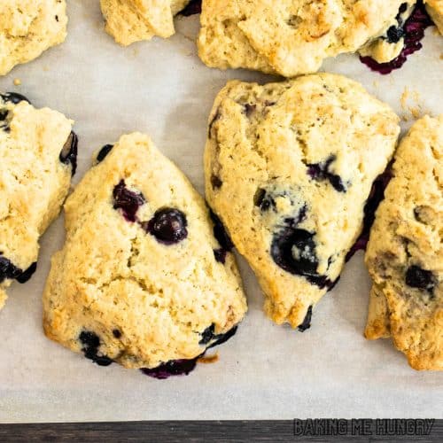 starbucks blueberry scone recipe, shown as sconeson parchment lined baking sheet