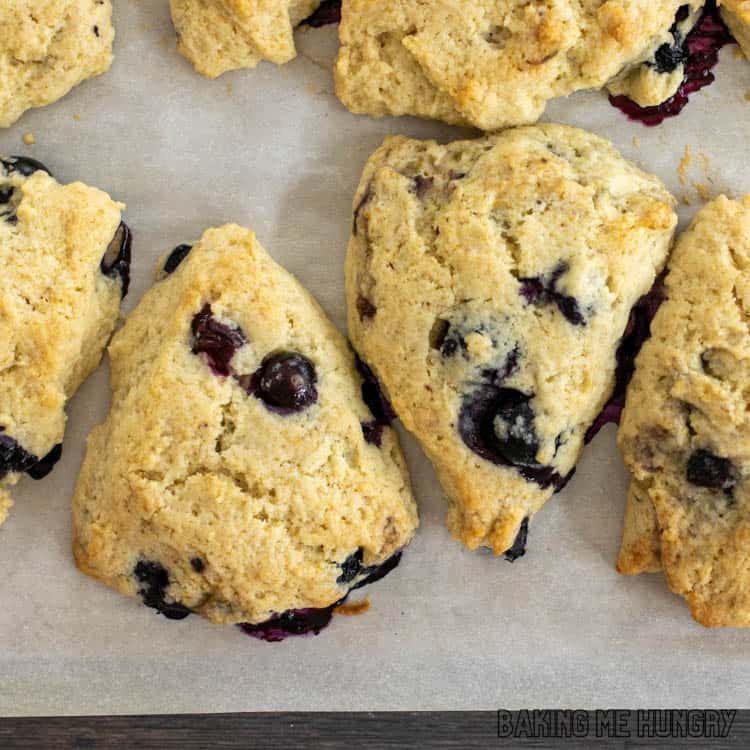 baked starbucks blueberry scones recipe on parchment lined baking sheet