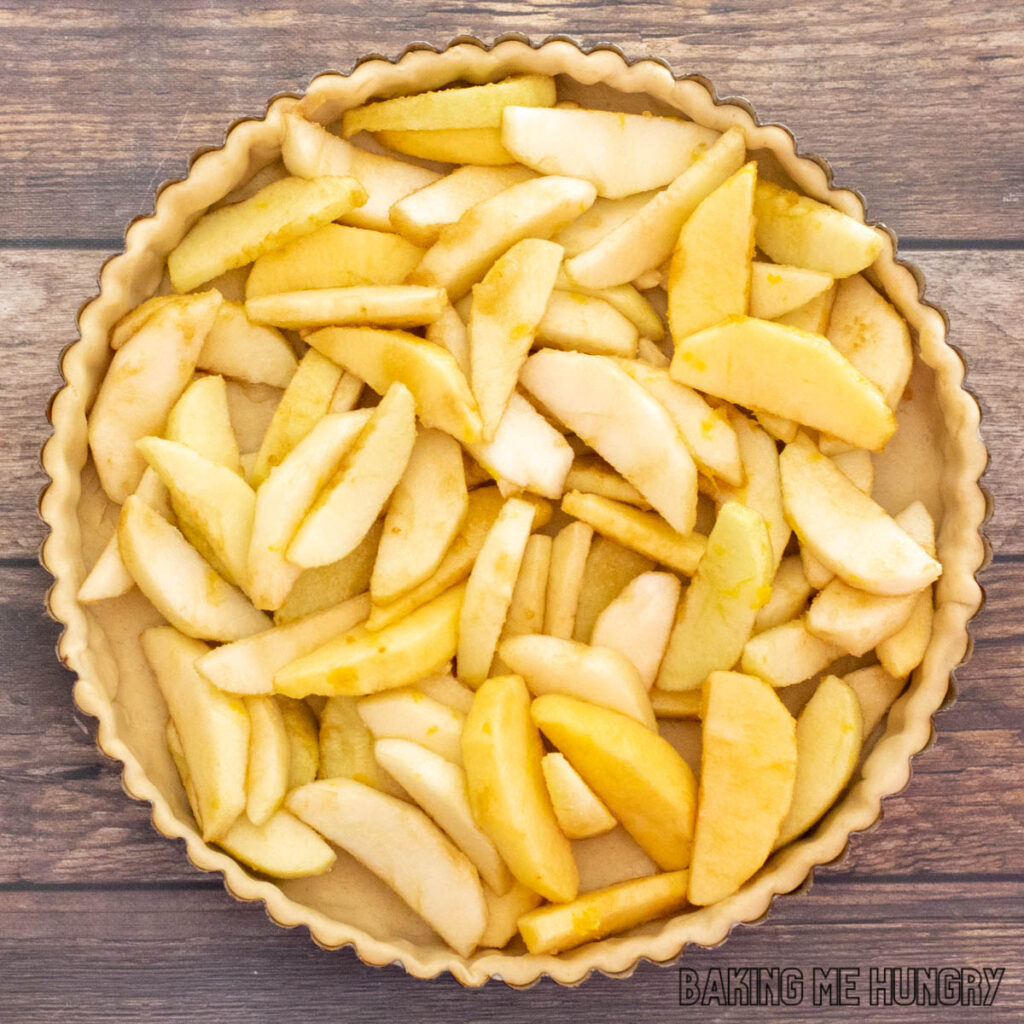 apples in pie crust lined tart pan